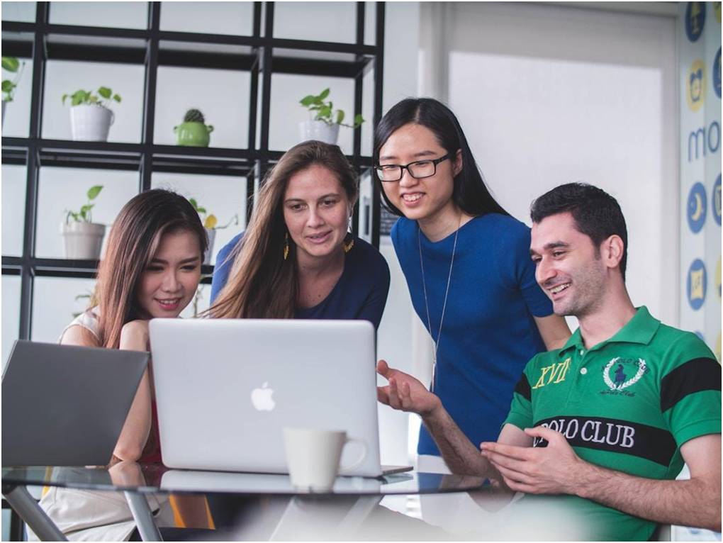  A group of professionals collaborating to implement multi-channel marketing strategies that enhance reach and engagement